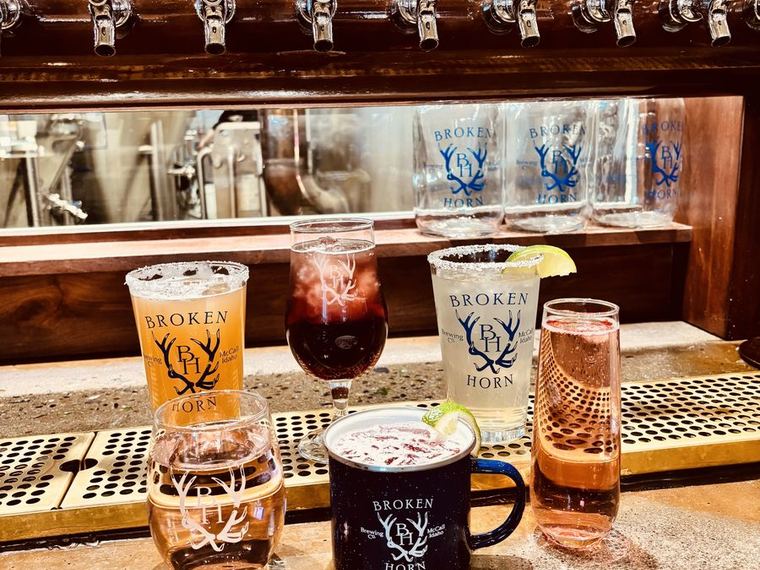 Broken Horn Brewing Co. tap wall and branded glassware